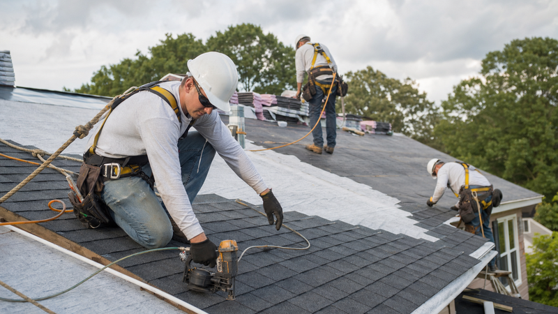 Professional roofing crew working on a residential jobsite in Georgia